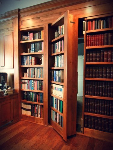 open secret bookcase door in office