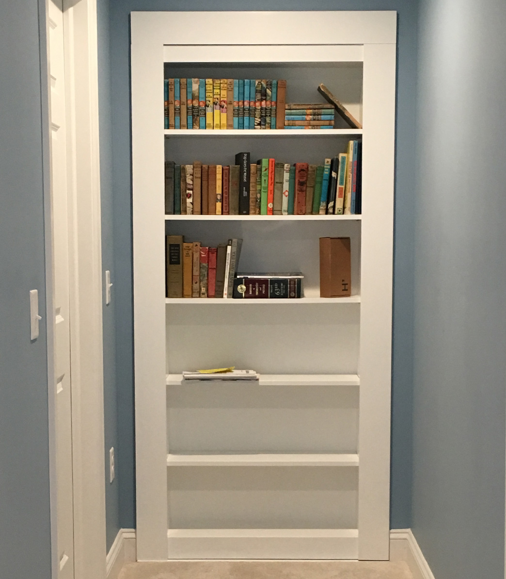 secret bookcase door in hallway