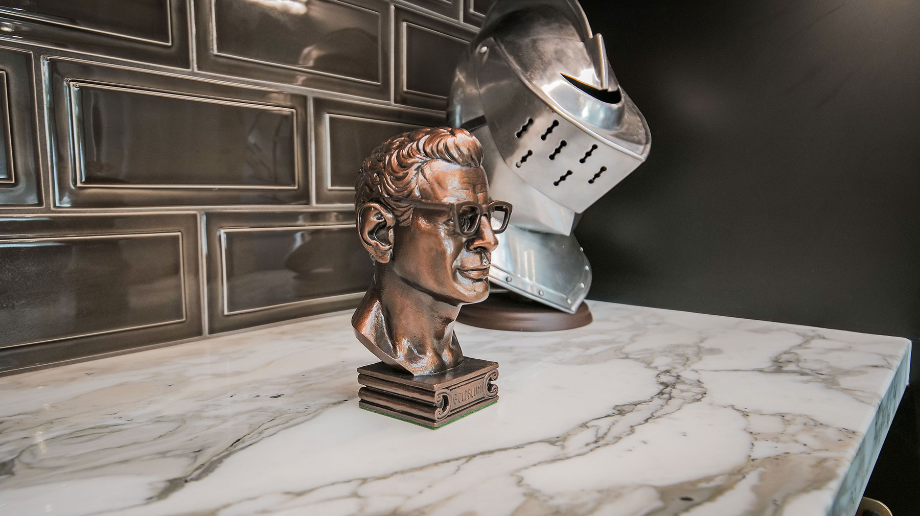 brass statue that is a secret button to open a hidden door