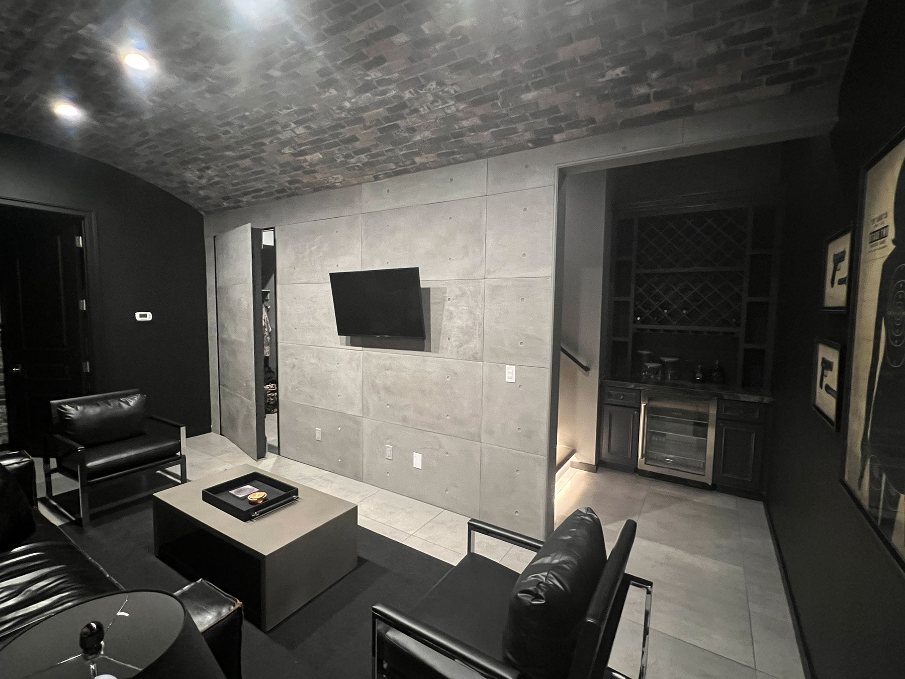 modern living room with a panel hidden door ajar next to the TV