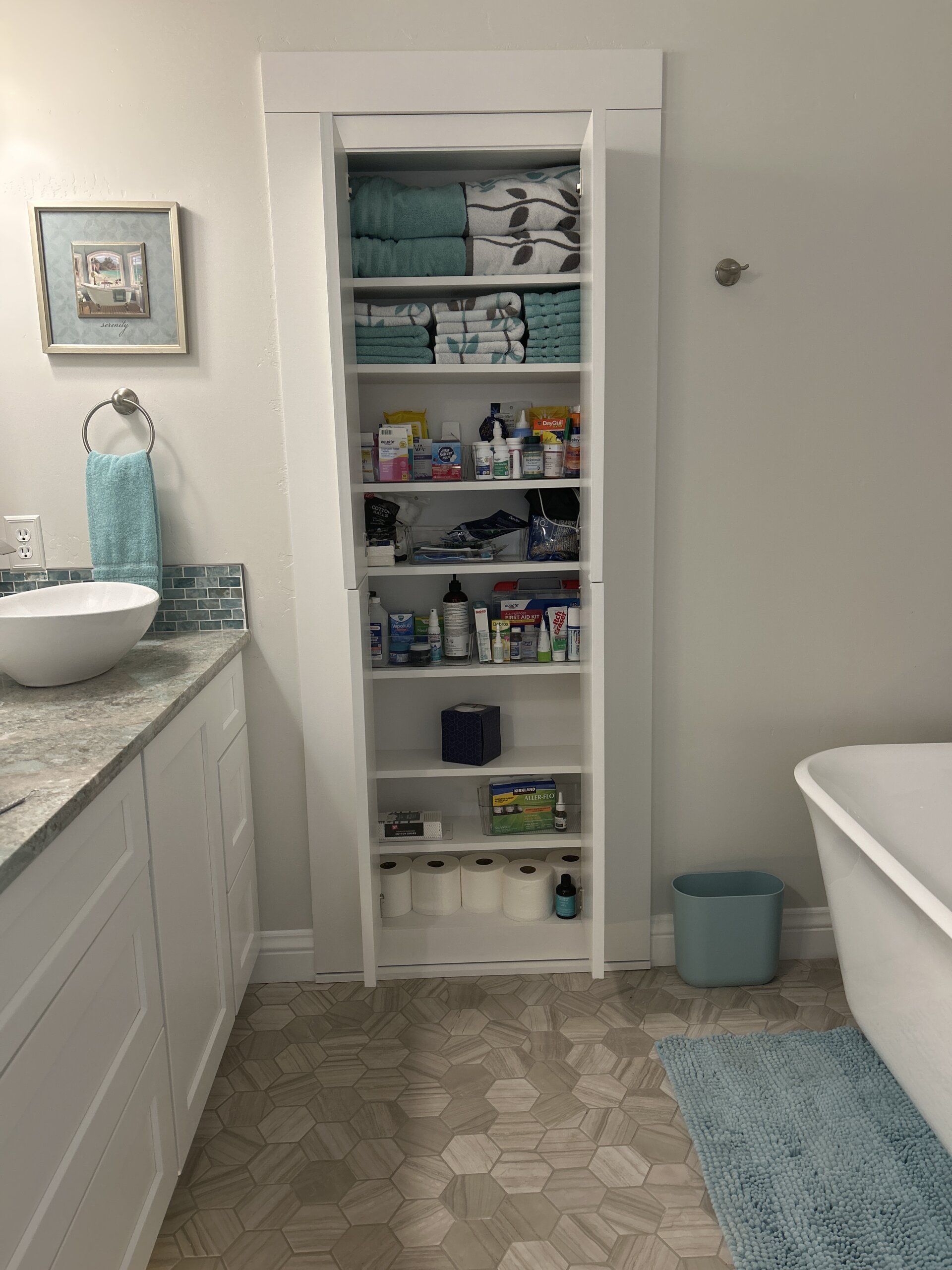 Closed Hutch secret door with cabinets open to look like bathroom storage