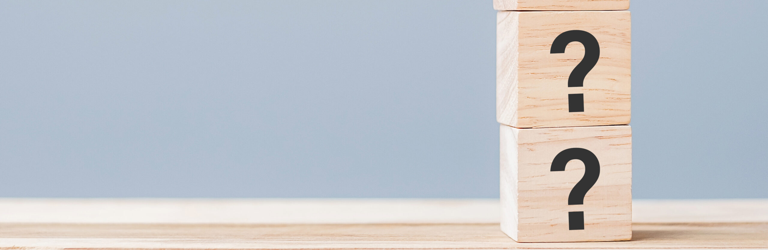 question marks on wooden cube blocks