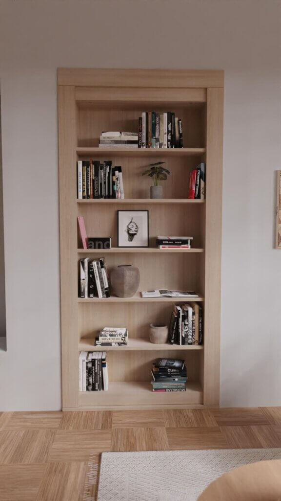 The DIY Bookcase Hidden Door Kit is a built-in wooden bookshelf with five shelves for books