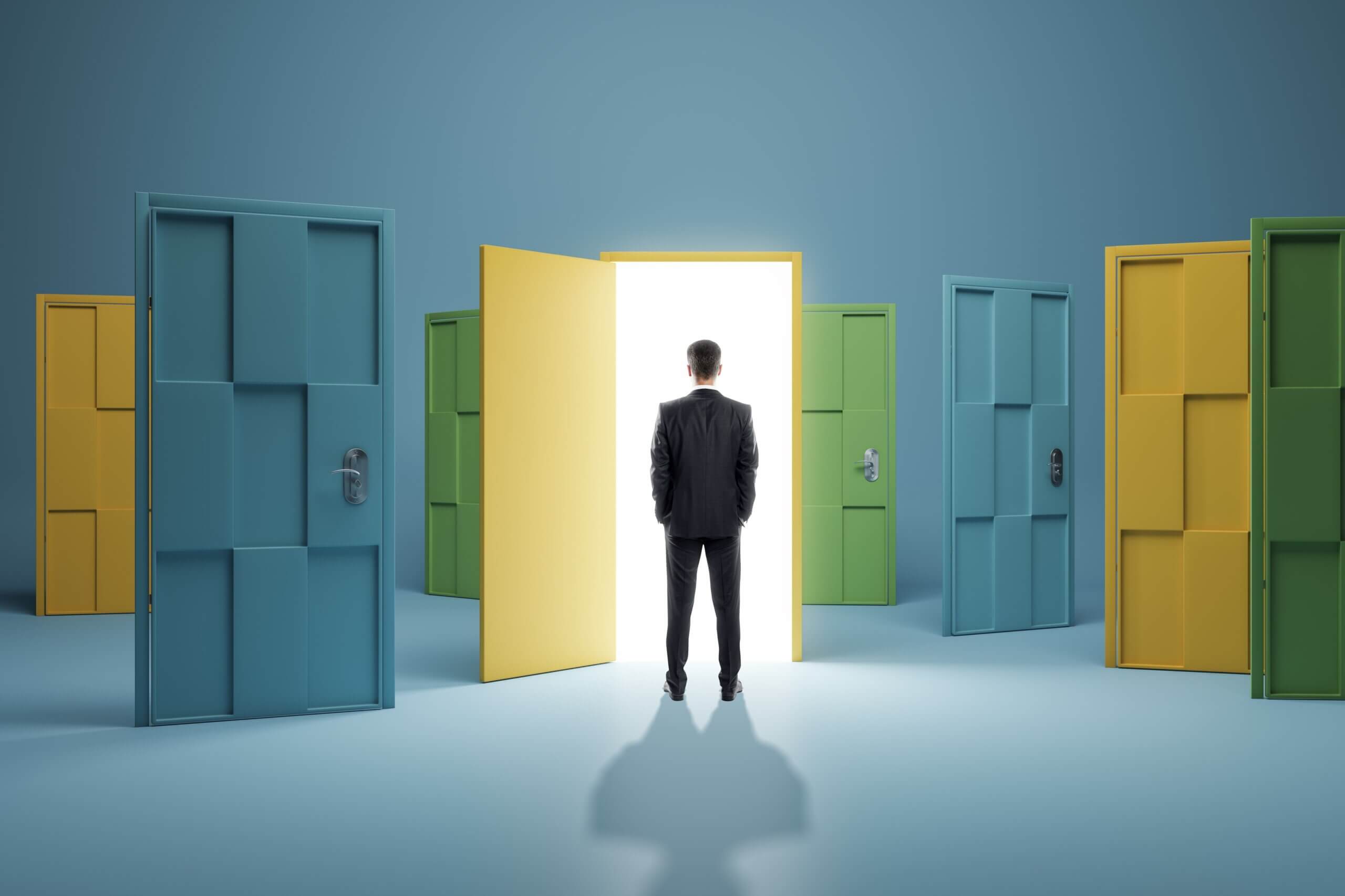 Man in a suit facing a glowing open door, surrounded by closed colorful doors in a surreal environment.