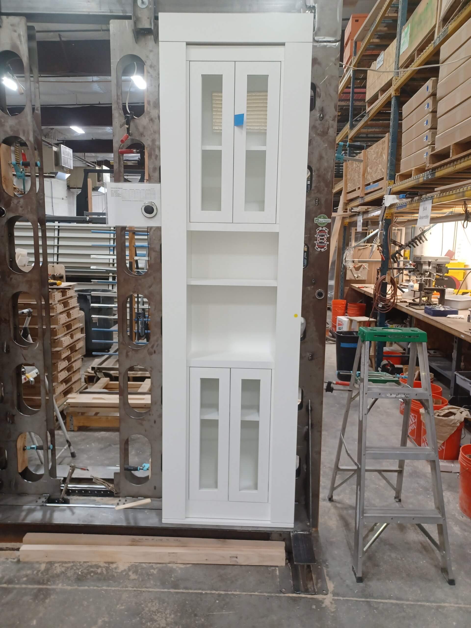 Premade overstock hutch secret door, white paint on maple wood.