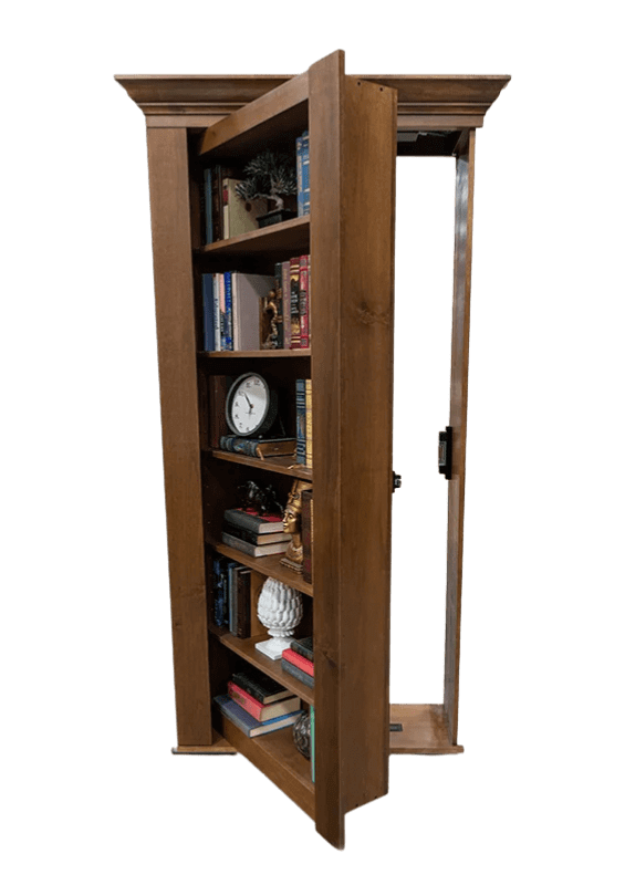 A standard hidden bookcase door partially open, revealing a secret doorway behind it. The bookcase is filled with books and decorative objects such as a clock, small sculptures, and plants. 